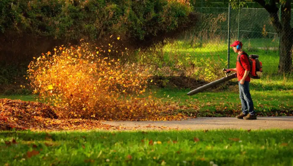 Man operating a heavy duty leaf blower.