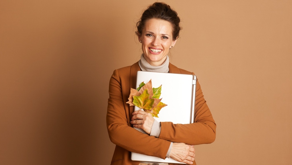 Modern Professional Embracing Autumnal Technology.