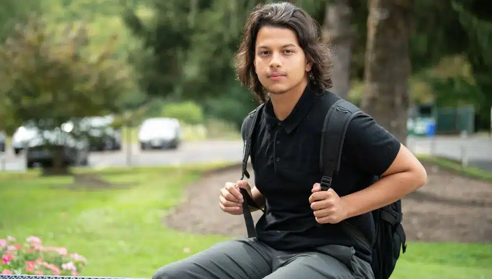 Brandy Torres on the Manor College campus, smiling and confident as a Liberal Arts major.