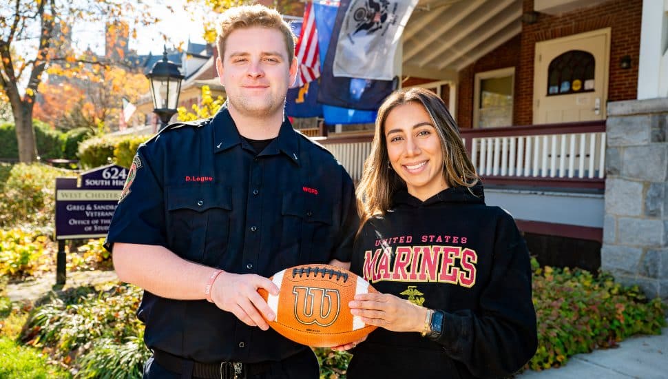 West Chester University students Sophia Feliciano and Dylan Logue hold the game ball outside WCU’s Veterans Center ahead of the University’s Military and First Responder Appreciation Game. Feliciano, a Marine Corps veteran and junior criminal justice major from Coatesville, and Logue, a senior criminal justice major and firefighter with Fame Fire Company from Montgomery County, served as honorary captains during the Nov. 1 game at Farrell Stadium.