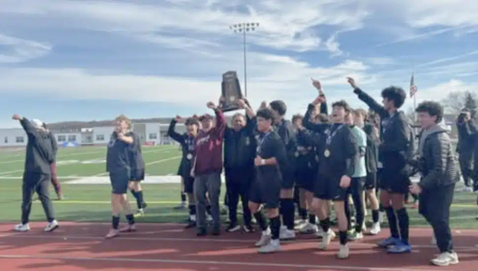 The Abington High School Boys Soccer Team celebrates state championship