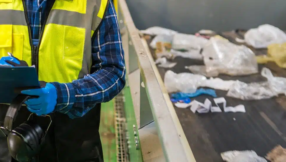 Waste Management Facility Worker Preparing Documentation.
