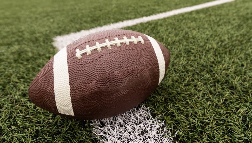 A football sits on the field.