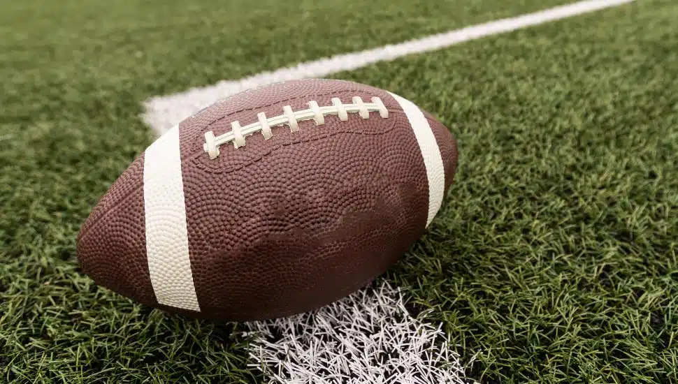 A football sits on the field.