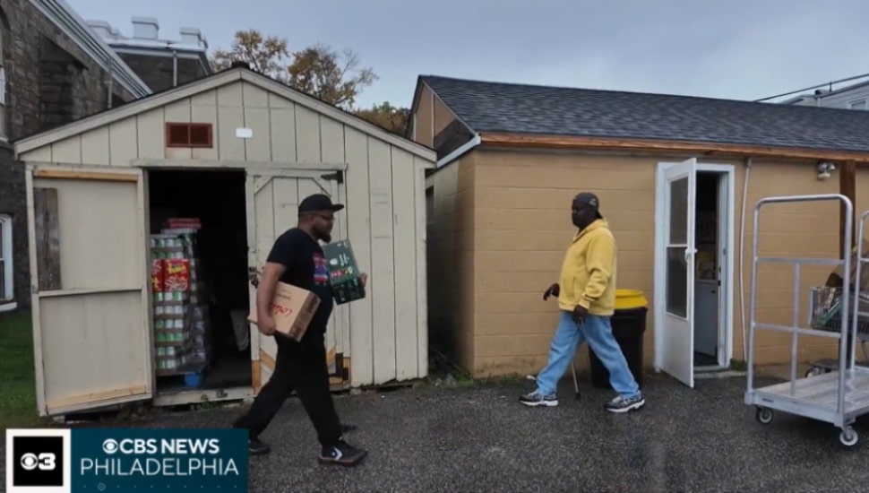 Recipients take food from a food pantry at Mount Zion C.M.E. Church in Sharon Hill.