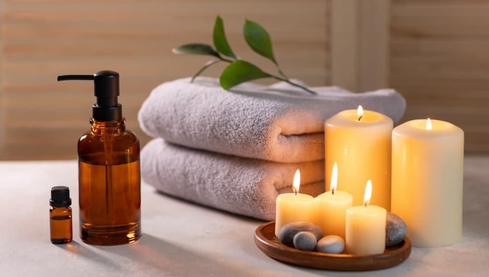 Lotions, candles, and towels at a day spa.