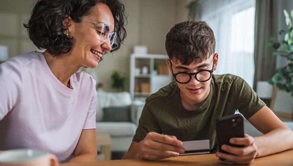Mother teaches her son about credit.