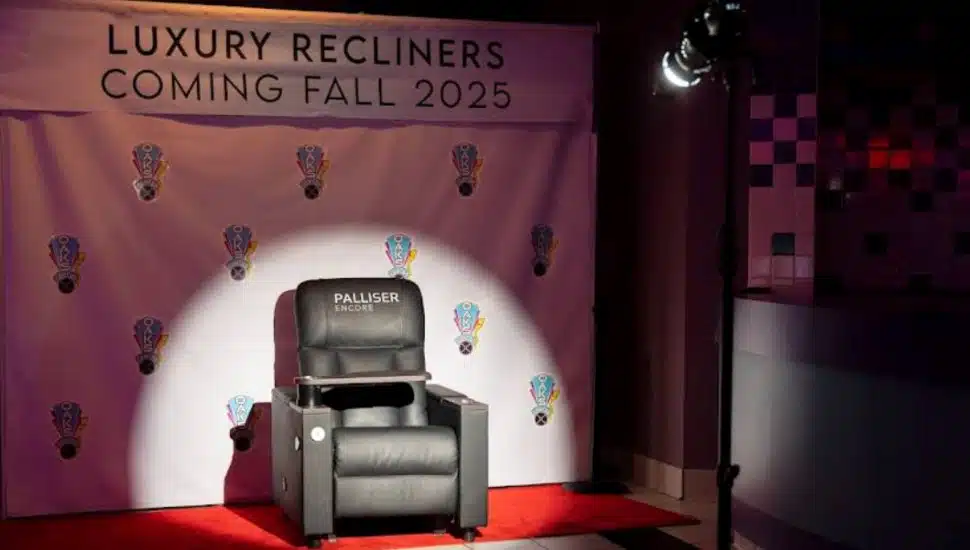 Luxury Palliser Encore recliner spotlighted at Oaks Center Cinema with signage announcing new luxury recliners coming Fall 2025.