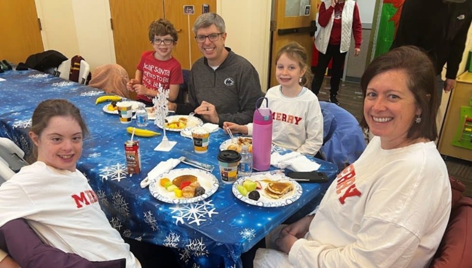 A family enjoys a pancake breakfast at this year’s Holiday Fun Fest at Arc of Chester County.