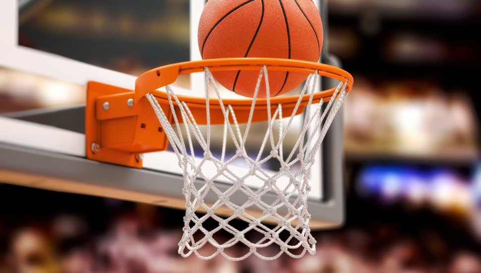 A basketball falls through the hoop.