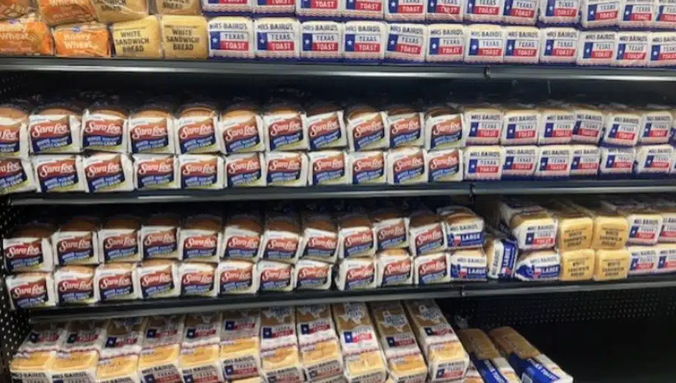 A grocery store aisle stocked with Bimbo Bakeries bread.