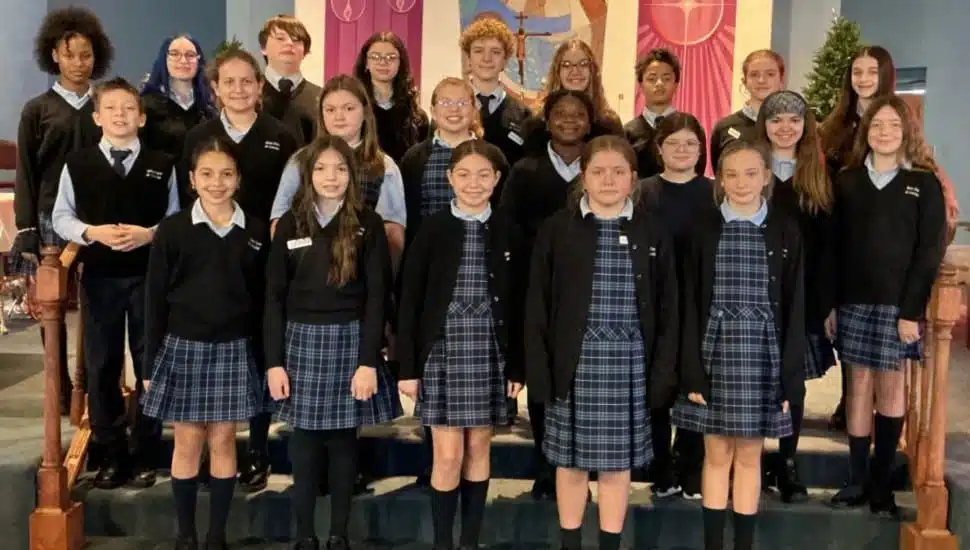 Students in the award-winning Notre Dame de Lourdes Choir, who took Top Place in the 2025 B101 Choir Competition include, left to right, front row, Kennedy T., Audrey H., Milana L., Cora H., Paige K.; second row, Mason F., Grace Z., Paisleigh E., Maeve O., Zanaa C., Vienna A., Autumn B., Andrea D.; back row, Harlee J., Mackenzie Q., Nicholas D., Natalie R., Jack H., Mikayla H., Cameron C., Pearl H., and Concetta T.