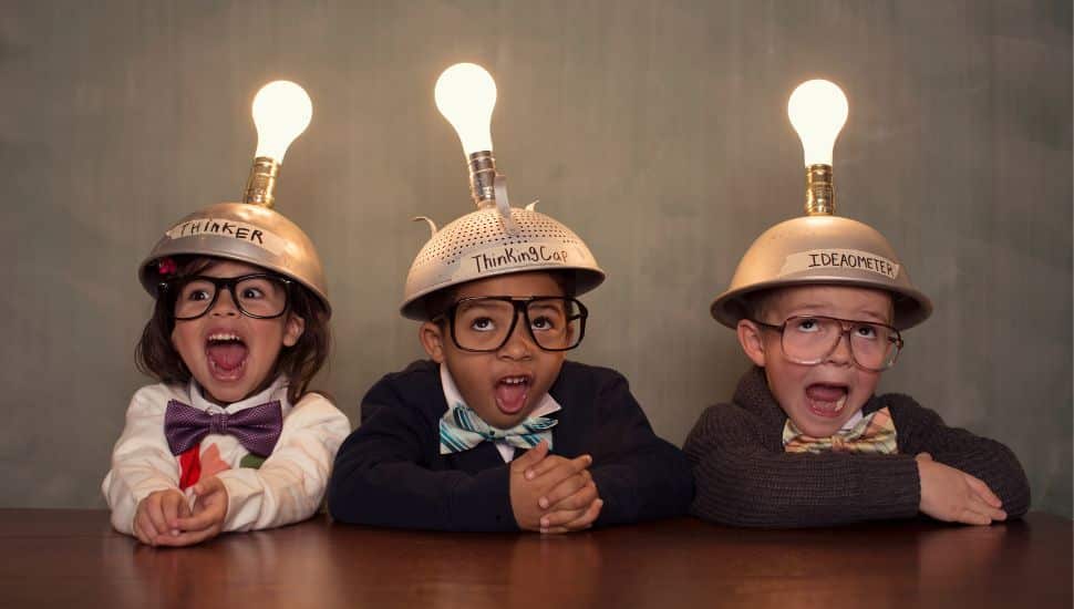 Kids in crazy hats with lights on their heads.