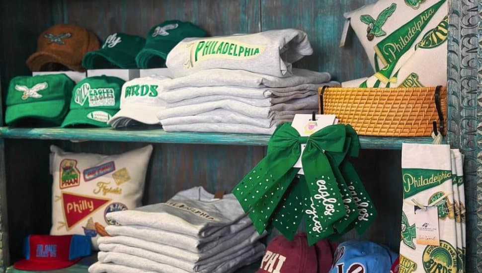 A shelf at Conshohocken's Sanctuary Blu displays Eagles sweaters, hats, and bows.