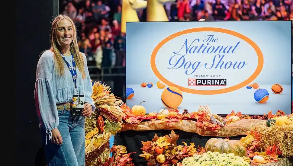 Lil Nagy stands by a display for The National Dog Show.