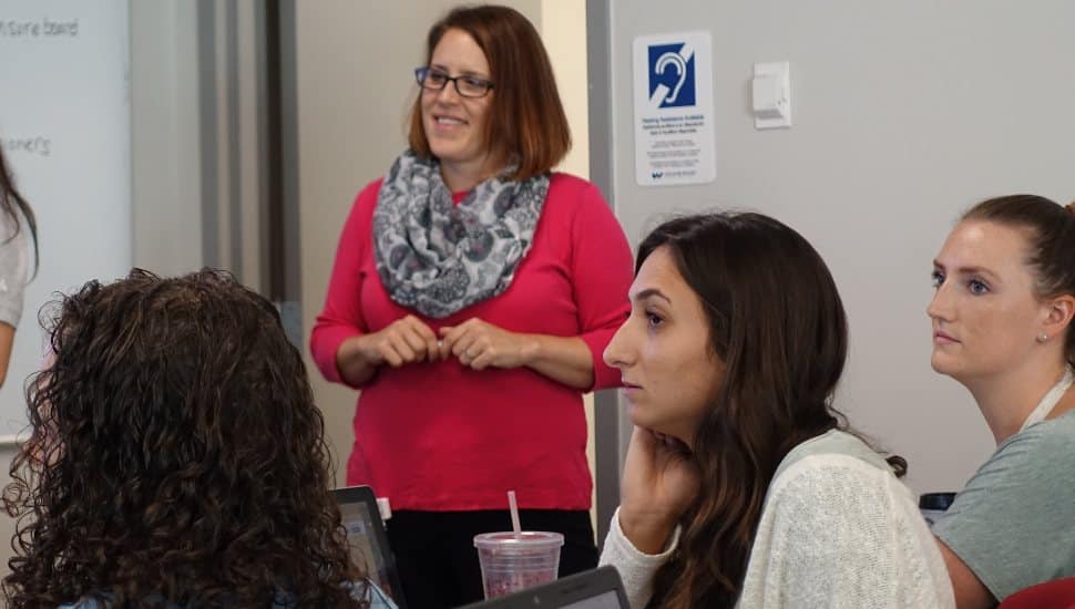 Andrea Tyszka speaking to occupational therapy doctoral students during an in-class discussion.