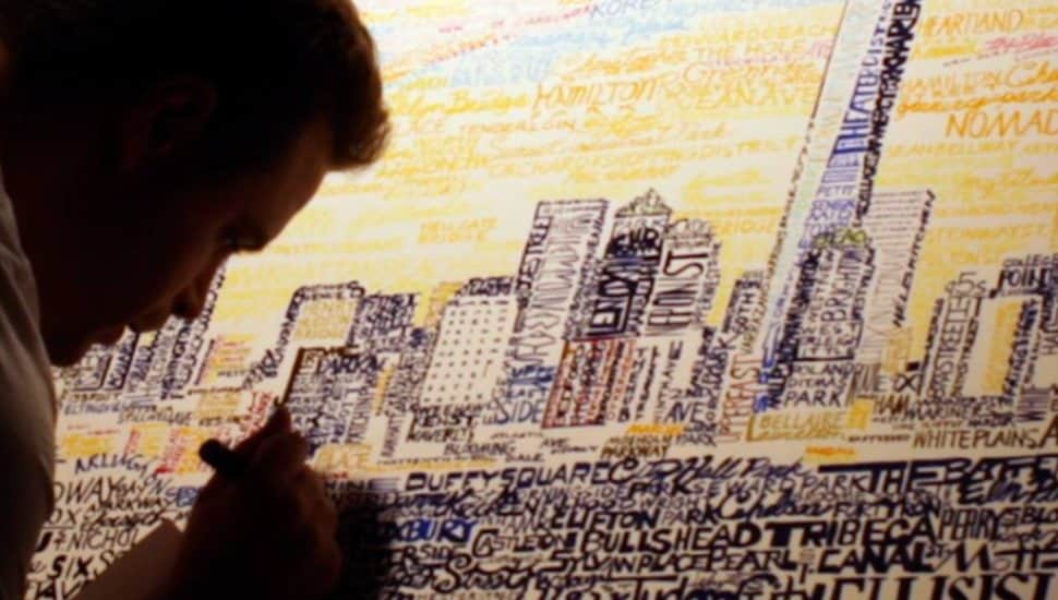 Dan Duffy works on a drawing of the Philadelphia skyline.