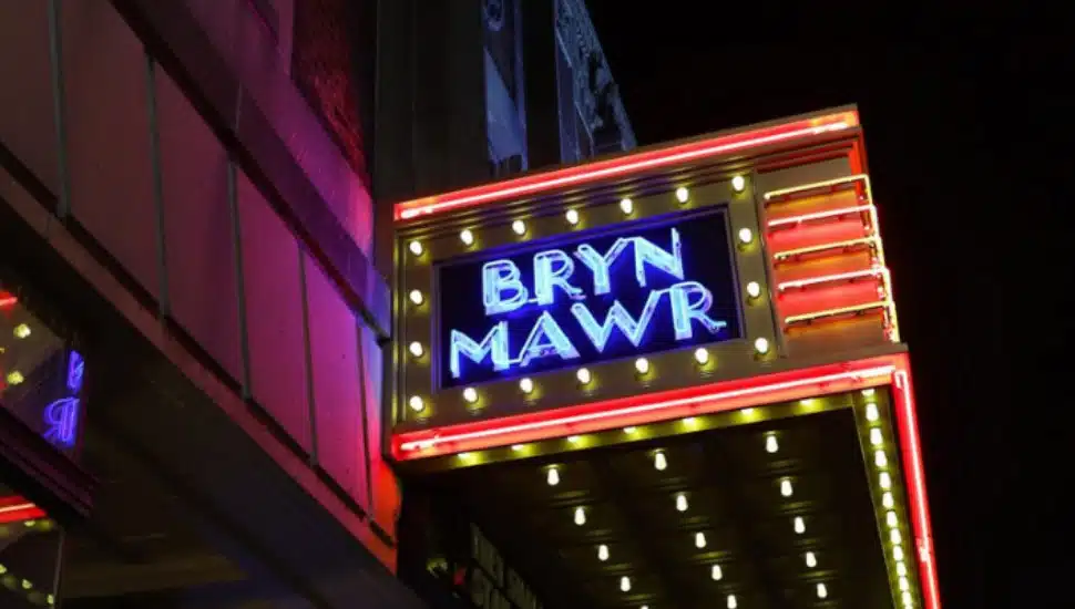 The marquee outside the theater lights up 'Bryn Mawr'.
