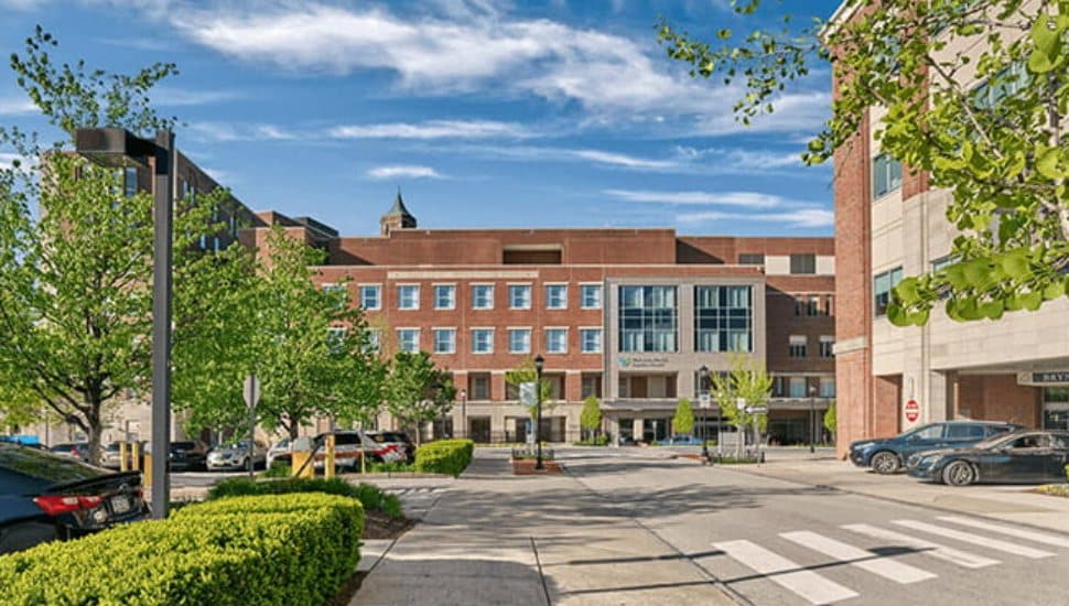 A street overlooks the Bryn Mawr Hospital Founders Building.