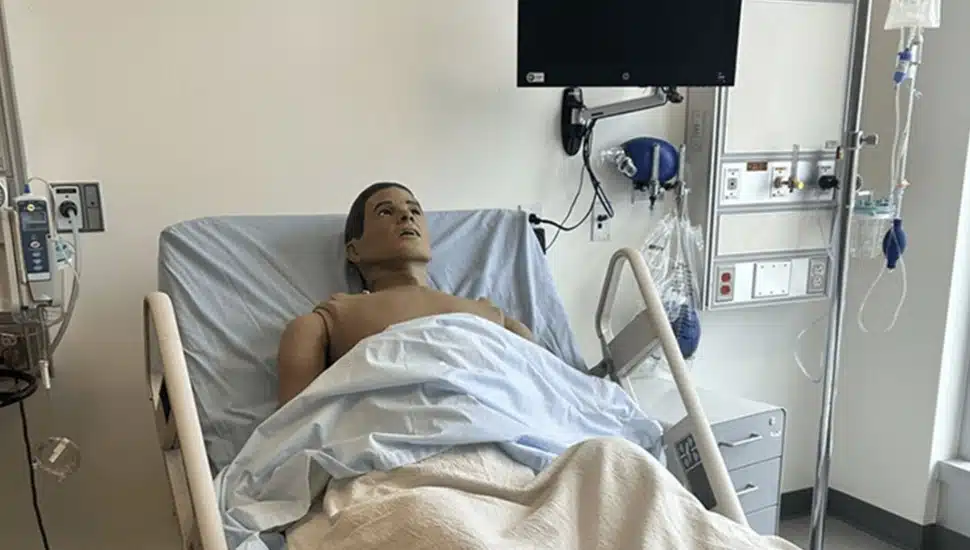 Mannequin in hospital bed.