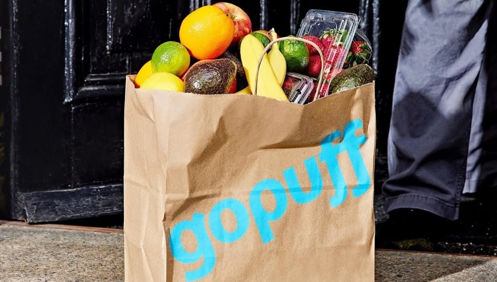 A Gopuff bag with bananas, avocados, strawberries, and more.