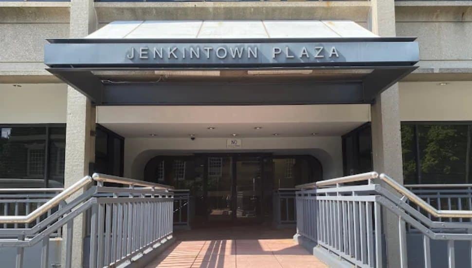 The sign above a building entrance reads Jenkintown Plaza.