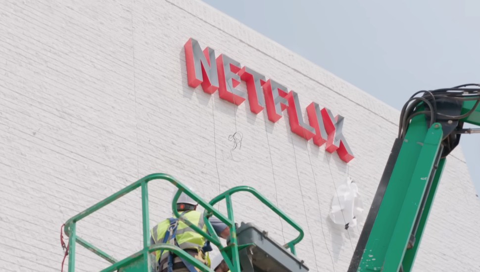 The sign for the Netflix House hangs outside the building.