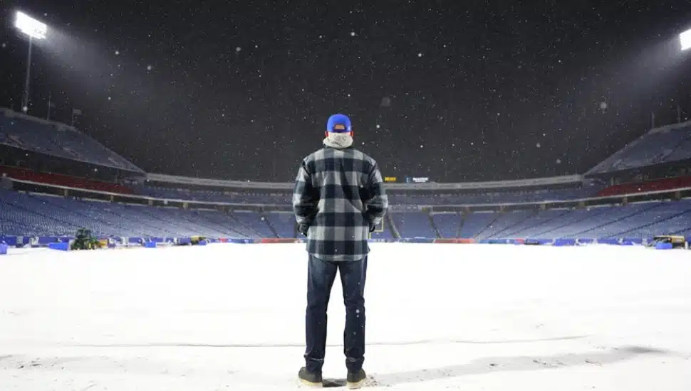 Sean McDermott stands on the snowy field in Buffalo.