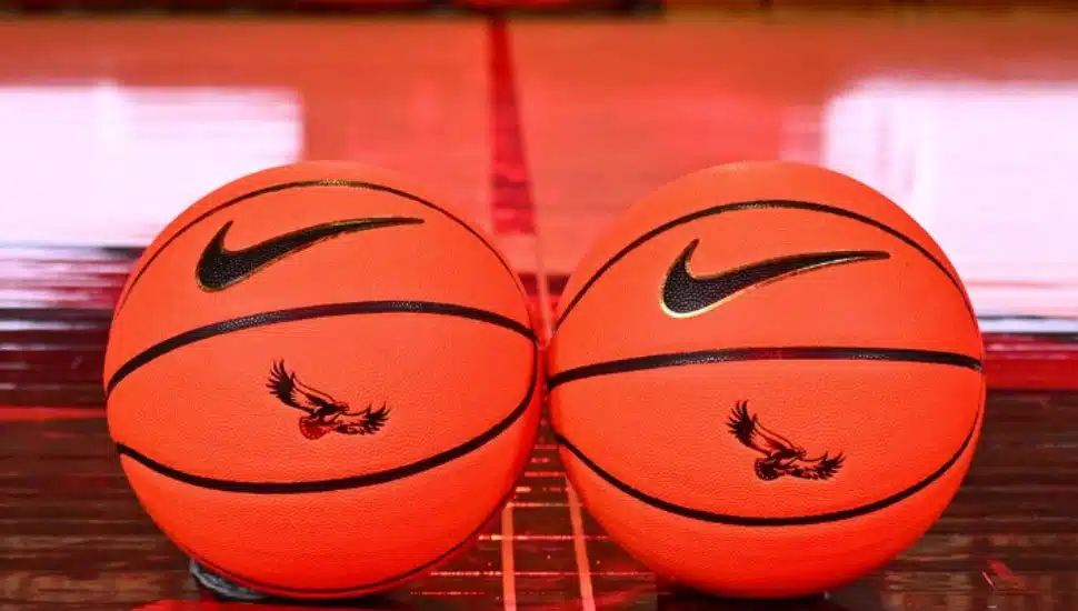Two basketballs with the St. Joe's Hawk branded.