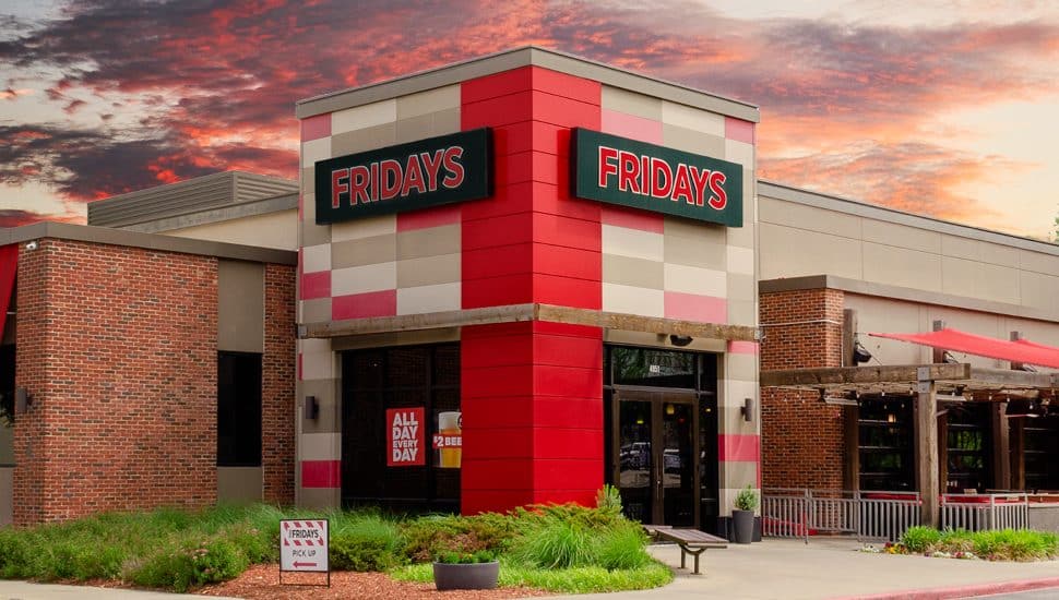 TGI Fridays restaurant exterior at sunset.