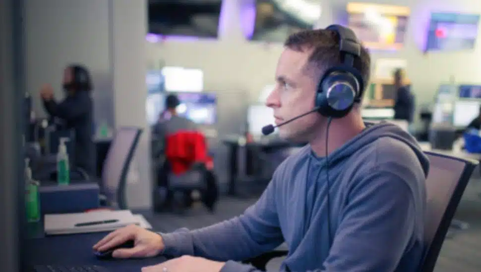 A ZeroEyes employee scans AI gun software.