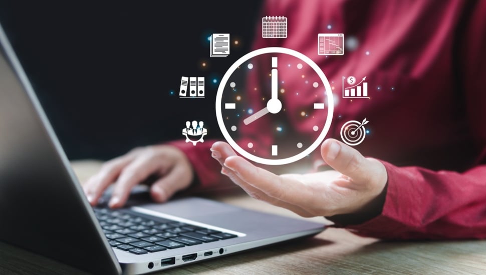Businessperson with virtual clock in hand.