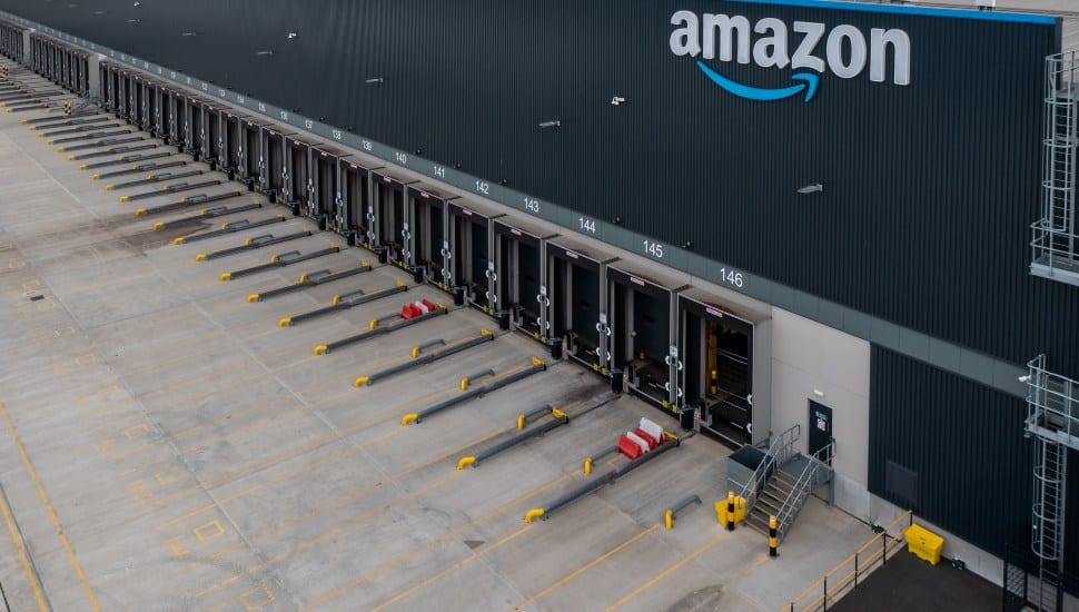 Aerial view of a the empty loading bays at a large Amazon Prime distribution warehouse.