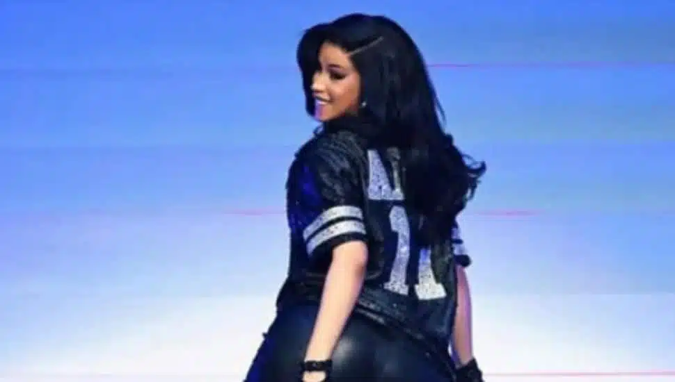 Cardi B dances on stage with her back turned to the audience.