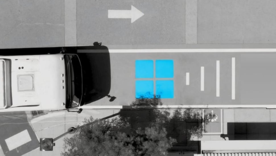Aerial view of a municipal bus approaching an InductEV charging station.