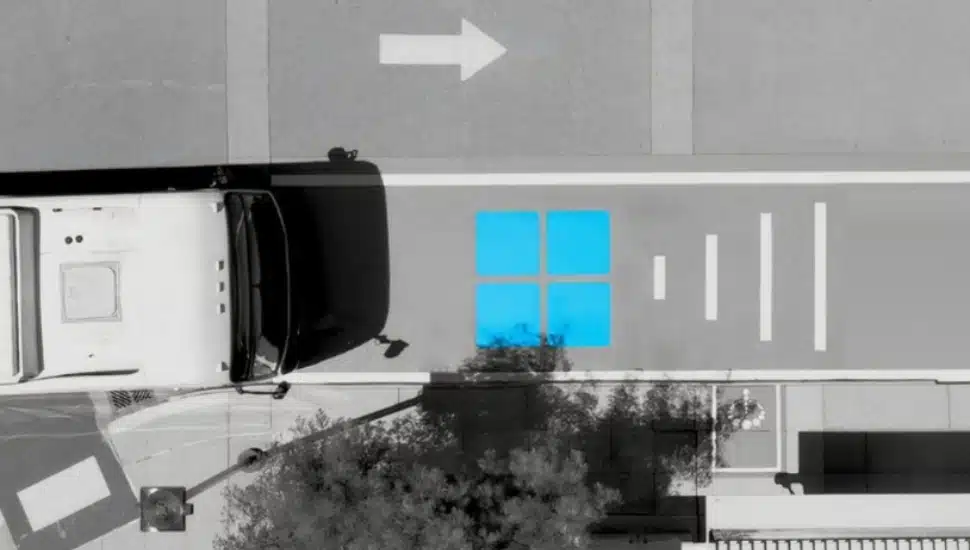 Aerial view of a municipal bus approaching an InductEV charging station.