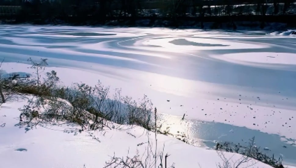 The Schuylkill River lies frozen.