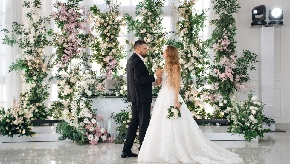 A bride and groom dance on the dance floor.