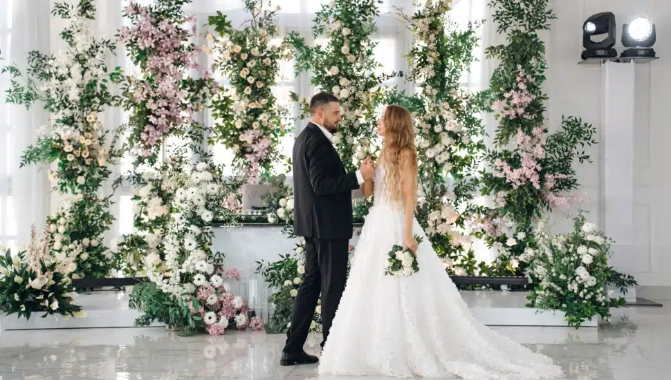 A bride and groom dance on the dance floor.