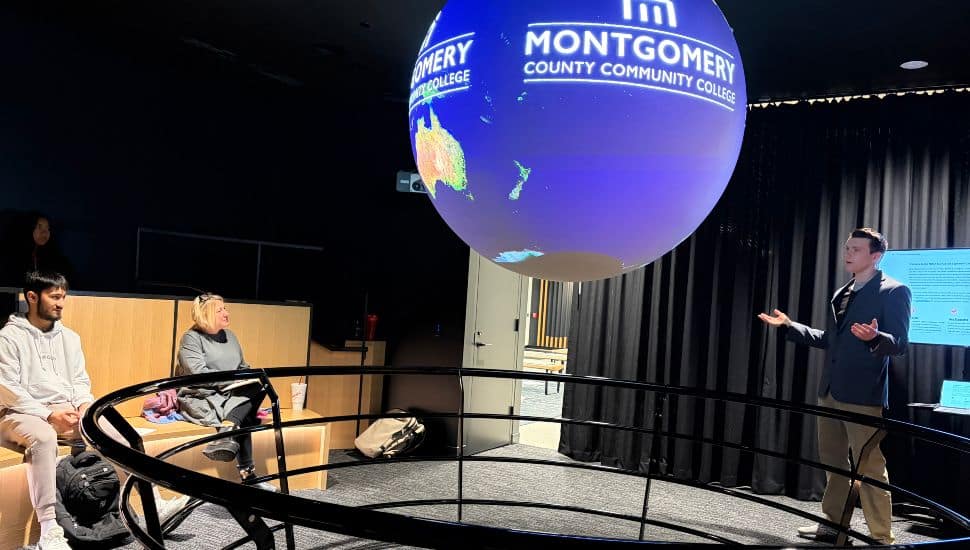 Montgomery County Community College student presents speech using Science on a Sphere in South Hall on the Pottstown Campus.