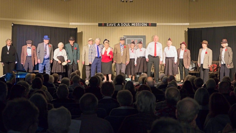The Freedom Village Players cast of Guys and Dolls SR take a curtain call before an appreciative audience.