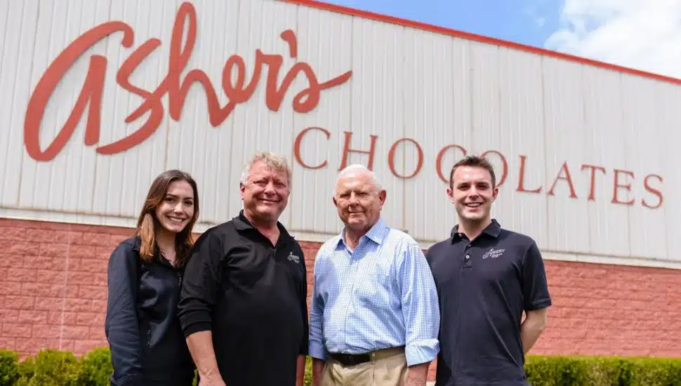 Three generations of Asher's stands outside the Souderton headquarters.