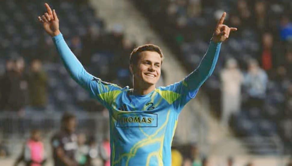 Cavan Sullivan celebrates on the soccer pitch.