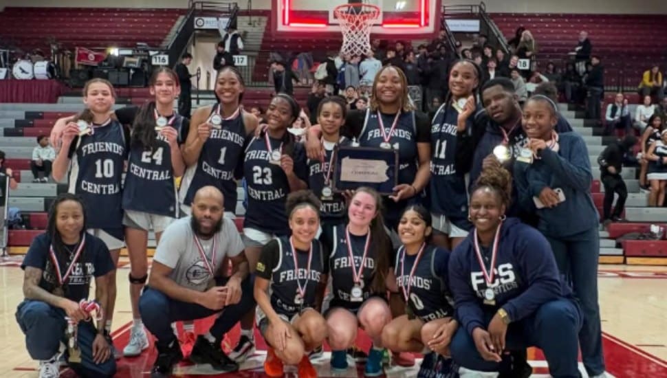 The Friends Central School girls basketball team poses on the court after PAISAA win.