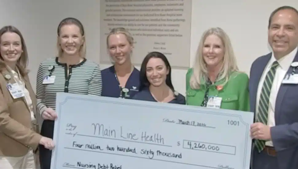 Main Line Health CEO Ed Jimenez and Bryn Mawr nurses accept anonymous donation.