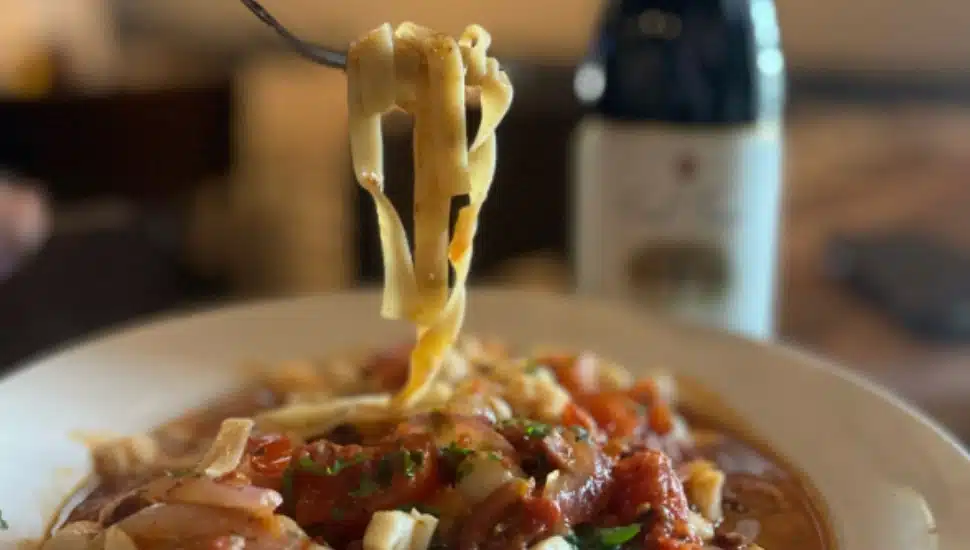 A fork lifts pasta from a dish at Pepperoncini.
