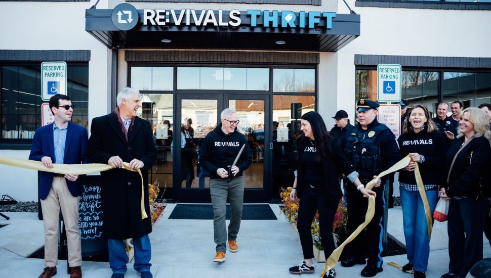 People gathered at Revivals Thrift's ribbon-cutting ceremony.