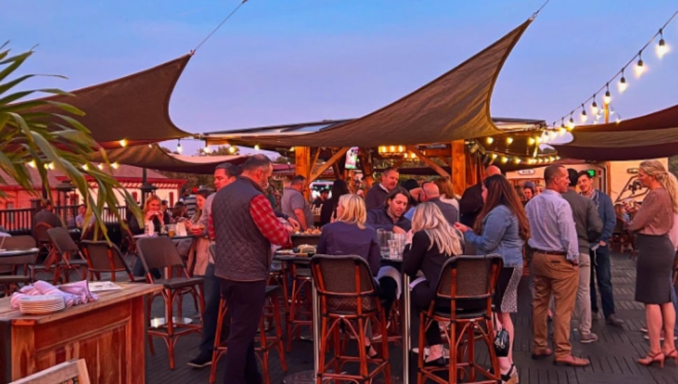 Patrons imbibe on the rooftop of Conshohocken's Great American Pub.