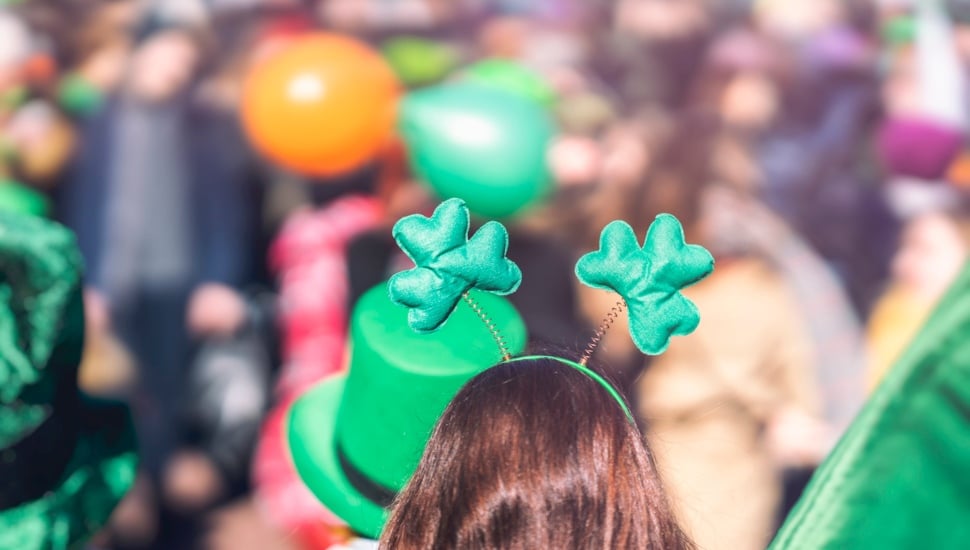 Clover head decoration on head of girl close-up. Saint Patricks day.