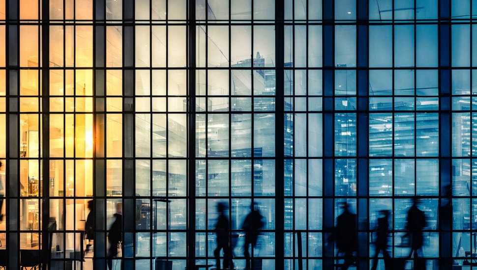Buildings windows with employees working inside.